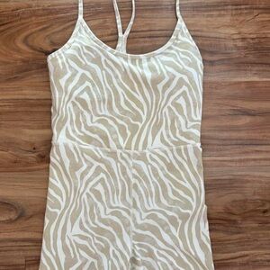 cream zebra active romper